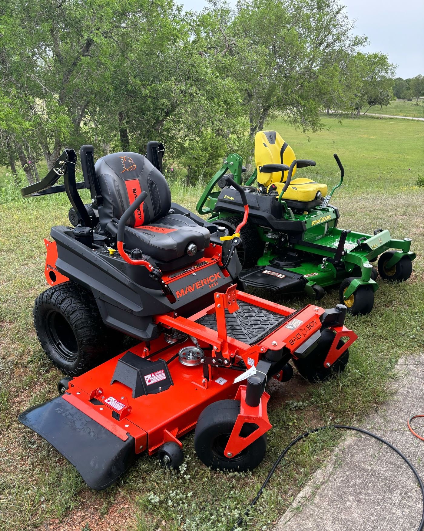 Bad Boy Maverick HD and John Deere Z740R zero-turn mowers