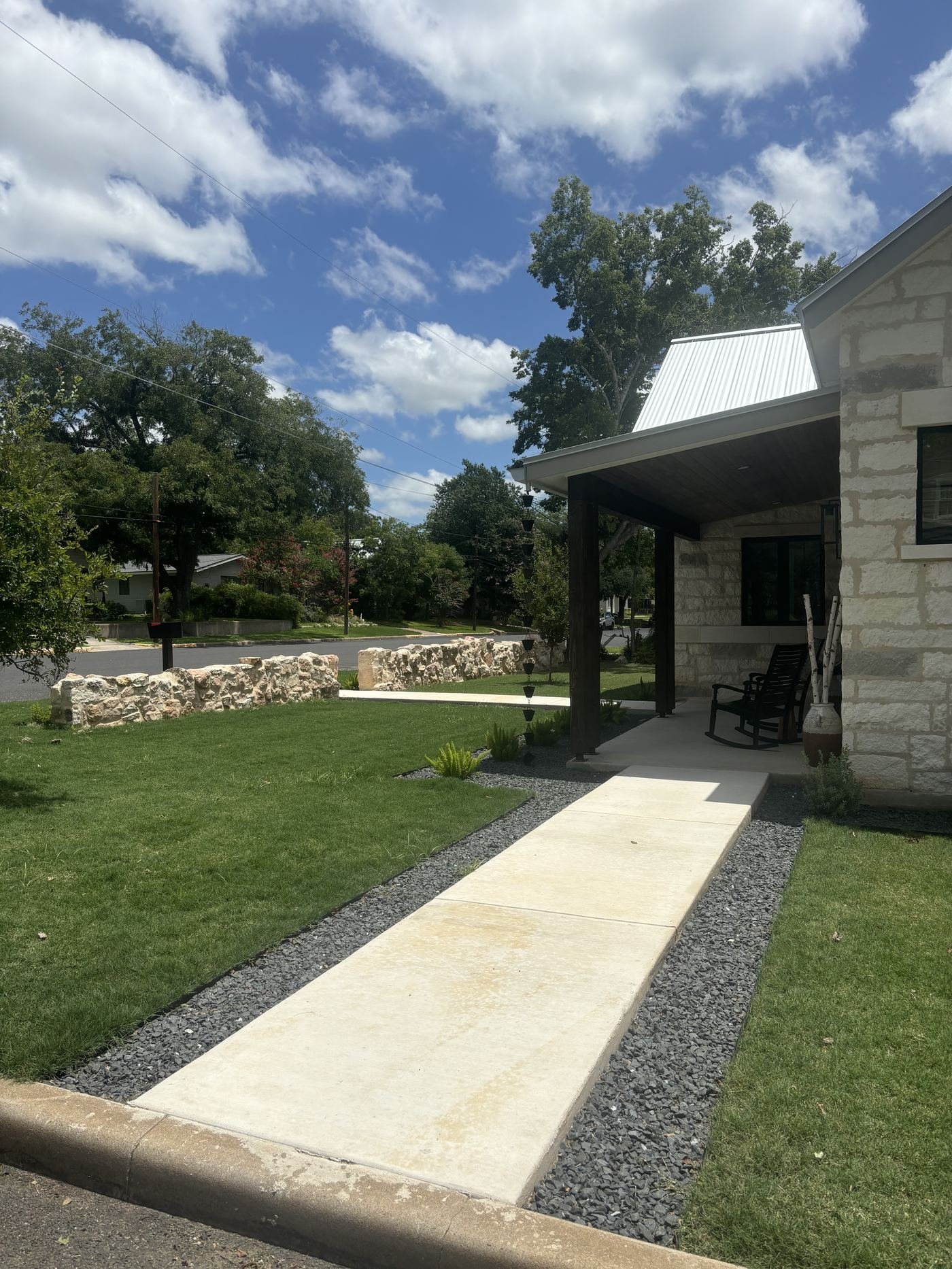 Front walkway with gravel border and native plantings